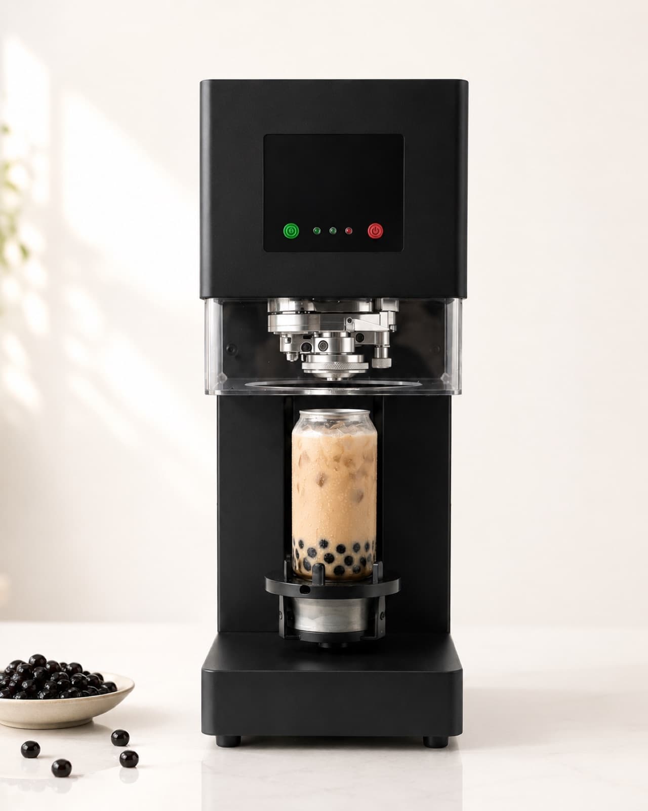 The seamer sealing a can of boba milk tea