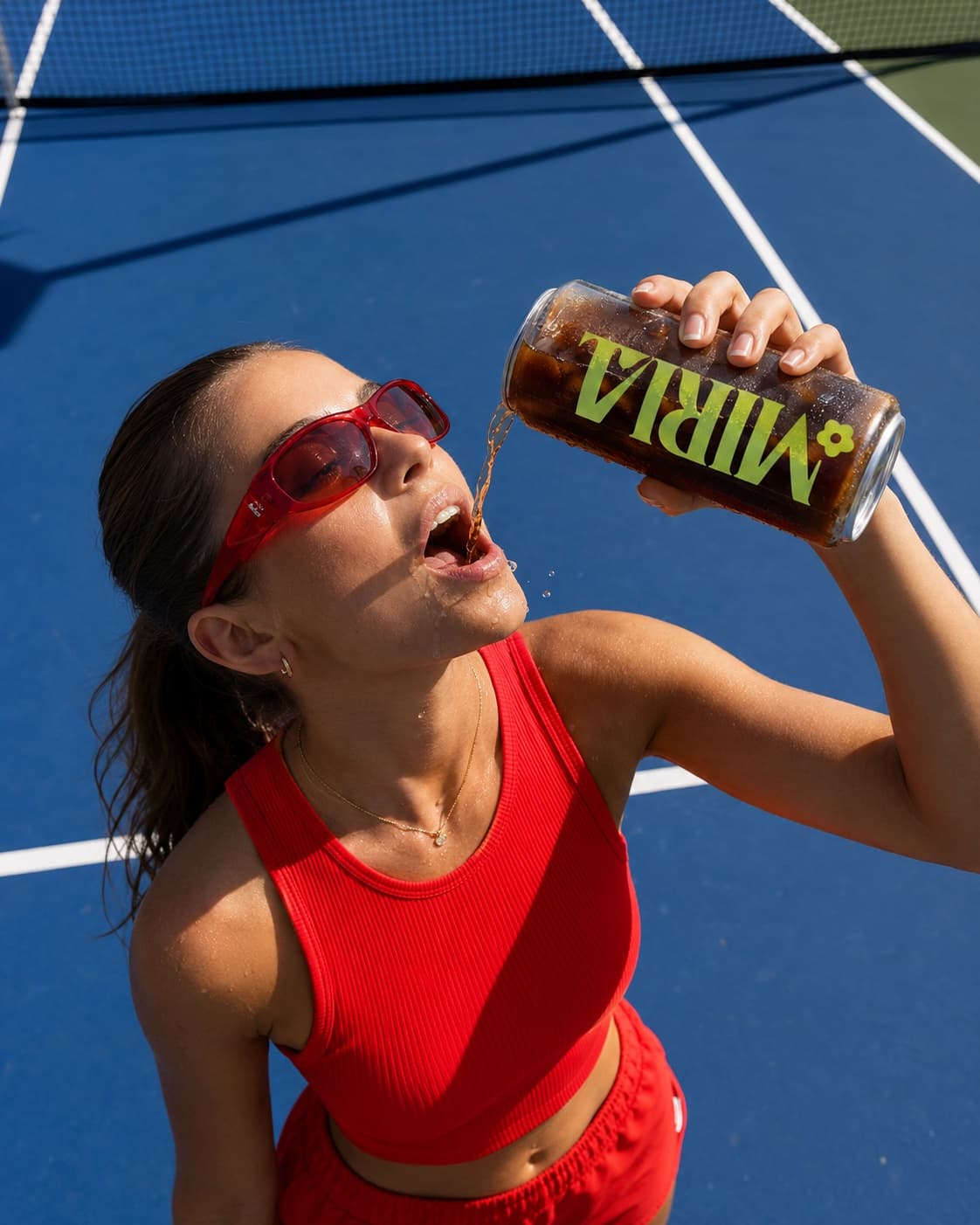 A customer drinking from a clear can courtside